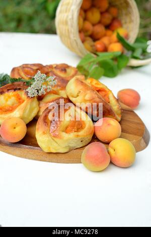 Buns made from yeast dough with apricot Stock Photo