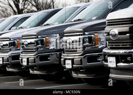 A row of new Ford F-series pick-up trucks at a car dealership in Columbia, Maryland on April 13, 2018. Stock Photo
