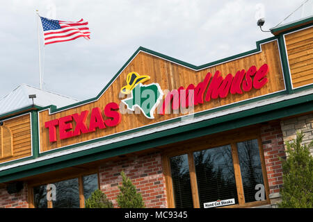 A logo sign outside of a Texas Roadhouse restaurant location in Columbia, Maryland on April 13, 2018. Stock Photo
