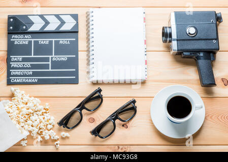 set of film industry objects on a wooden background close-up view from above Stock Photo