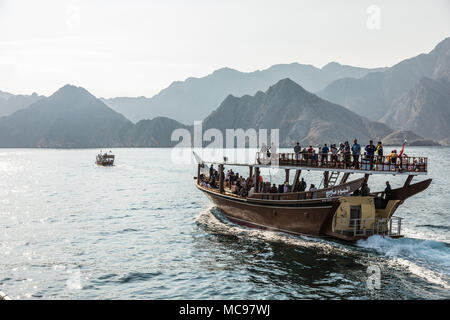 MUSANDAM, OMAN - JANUARY 25, 2017: Dhow tourist cruise on the Fjords near Khasab on 25 January 2017 in Musandam, Oman Stock Photo