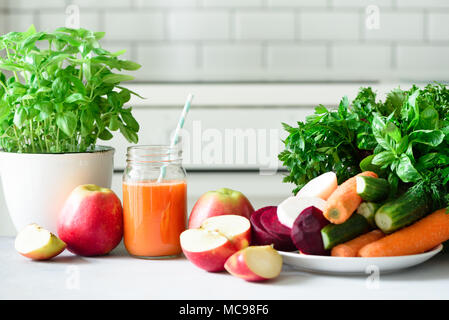 Fresh juice or smoothie, fruits and vegetable - apples, carrot, beet, celery, cucumber, greens, herbs. Vegetarian, raw food concept, clean eating, det Stock Photo