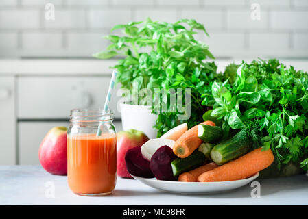 Fresh juice or smoothie, fruits and vegetable - apples, carrot, beet, celery, cucumber, greens, herbs. Vegetarian, raw food concept, clean eating, det Stock Photo