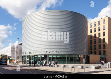 The large, drum-shaped building of The University of Manchester, University Place, Oxford Road, Manchester. Stock Photo