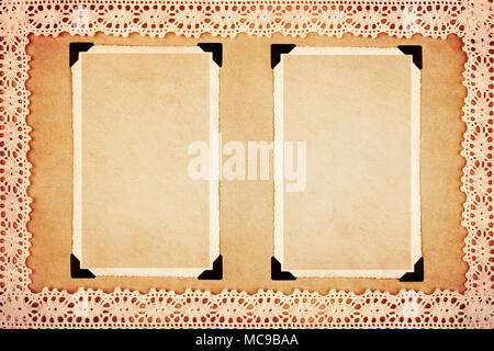 Two blank retro photo frames on decorative paper framed with lace. Grunge style. Stock Photo