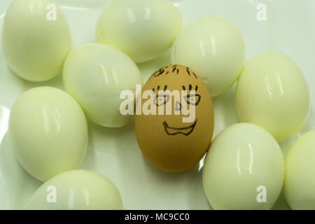 Appetizing fried eggs in a frying pan. Rye toast and pickled cucumber next to fried eggs Stock Photo