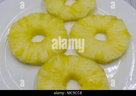 Top view of canned pineapple rings isolated on white Stock Photo