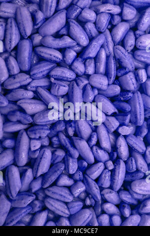 Background of nuts - cashew, pecan, pine nuts, hazelnuts - on dark blue background with copy space. Top view or flat lay Stock Photo