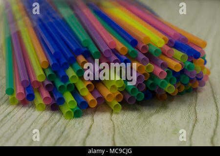 Ceramic white glass with paper wave pattern tubules at white table in the interior of the kitchen Stock Photo