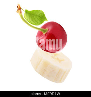 Isolated fruits. Fresh Sliced banana and  cherry isolated on white background with clipping path as package design element and advertising. Stock Photo