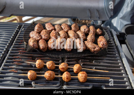 lots of cevapcici sausage on a grill in sweden Stock Photo