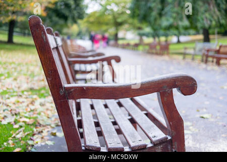 Benches along the way in Princes Street Gardens, the public space in city center of Edinburgh. Stock Photo