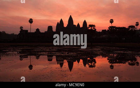 Siem Reap, Cambodia - January 19, 2011: Sunrise at the archeological wonder Angkor Wat complex. Stock Photo