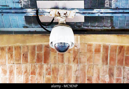 Security CCTV Camera on the old wall. Stock Photo