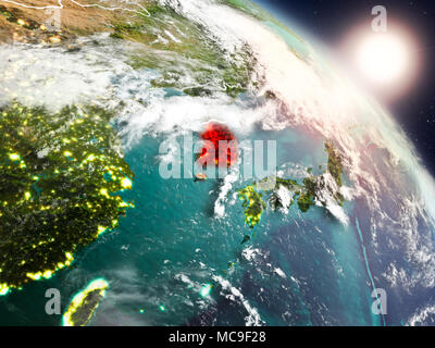 Sunrise above South Korea highlighted in red on model of planet Earth ...