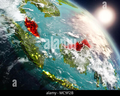 Sunset above Malaysia from space on planet Earth with visible country borders. 3D illustration. Elements of this image furnished by NASA. Stock Photo