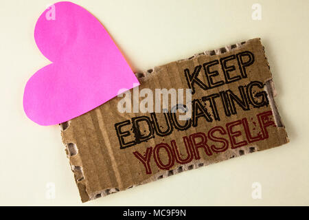 Handwriting text Keep Education Yourself. Concept meaning Learning skills with your own competencies written Tear Cardboard Piece on the plain backgro Stock Photo