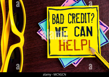 Text sign showing Bad Credit Question We Can Help Motivational Call. Conceptual photo achieve good debt health written Yellow Sticky note paper wooden Stock Photo