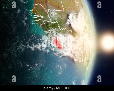 Liberia during sunrise highlighted in red on planet Earth with visible ...