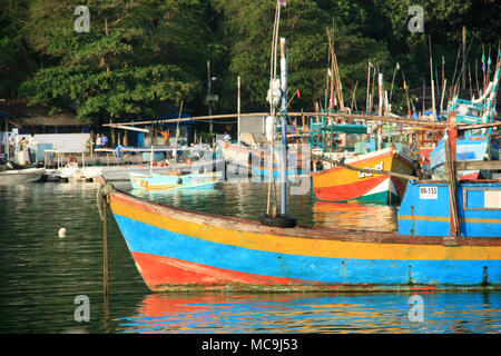 Early morning in the port of Mirissa, Sri Lanka: After the fishermen have off-loaded their trawlers, they anchor them in the port until next day Stock Photo