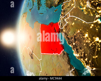 Satellite view of Egypt highlighted in red on planet Earth with clouds and visible country borders during sunset. 3D illustration. Elements of this im Stock Photo