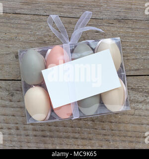 Box of pastel-colored Easter eggs and copy space Stock Photo