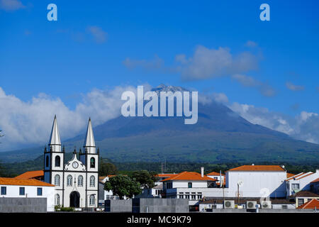 The port of Madalena on Pico island with the volcano in the background Stock Photo