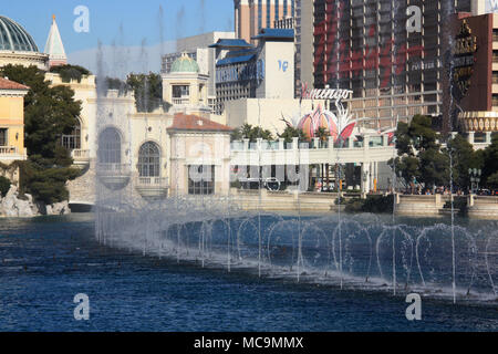 Dancing water fountains of the Bellagio Hotel & Casino with the Flamingo, the Imperial Palace and the Venetian in the background, Las Vegas, NV, USA Stock Photo