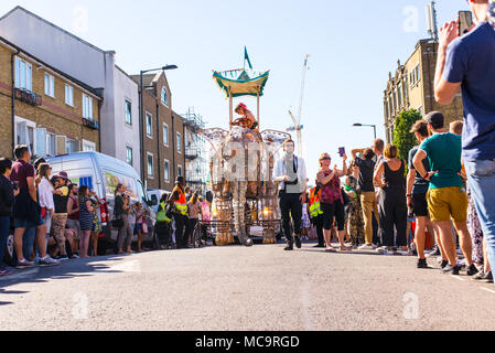 Hackney, London, UK. 11th September 2016. People watching the parade with a big elephant float approaching during the Hackney Carnival 2016 in Ridley  Stock Photo