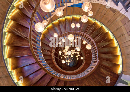Cecil Brewer Spiral Staircase featuring Bocci lights at Heal's Furniture Store, Tottenham Court Road, London UK Stock Photo