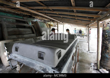 Bogor, Indonesia. 14th Apr, 2018. Workers on a fiber glass make truck and bus accessories in studio at Bogor, West Java, Indonesia. Product of bus and truck car such as front cowl bus, rear cowl bus, Dashboard bus, Front ducting bus, rear ducting bus, roof bus, and cover corner sold to bus companies and trucks to Asia. Credit: Adriana Adinandra/Pacific Press/Alamy Live News Stock Photo