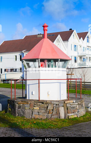 Coastal Norwegian lighthouse. Small white tower with red top. Haugesund, Norway Stock Photo