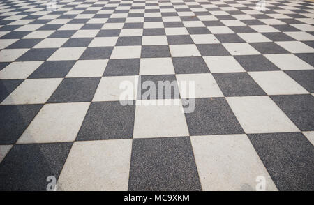 Black and White ceramic floor condition with grid line for background. Black and white walkway checkered pavement floor tiles seamlessly as a pattern. Stock Photo
