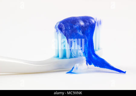 Toothbrush and toothpaste on white background. Stock Photo