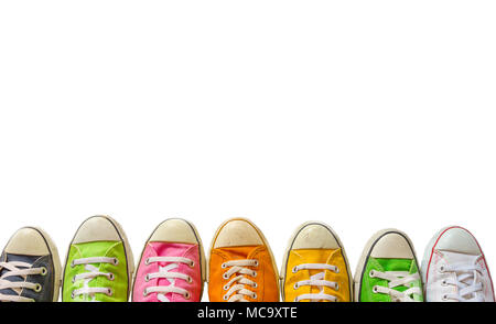 Variety of the colorful leather shoes on a white background.  sneaker shoes on , cool youth white yellow blue black gym shoes standing in circle on wh Stock Photo