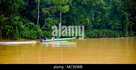 Kinabatangan, Malaysia - 09 May 2013 : Tourists on a boat cruise along the river of Kinabatangan, some of the most diverse concentration of wildlife i Stock Photo