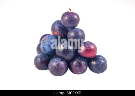 Sweet plum, prunes isolated on white background, Group of plums, prunes with leaf isolated on a white background. Fresh of plum, prunes fruit that hel Stock Photo