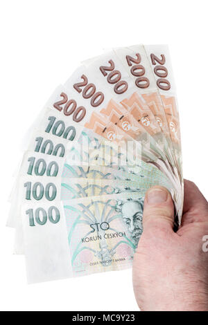 Czech money. Man holding and fanning out 100 and 200 korun banknotes. Stock Photo