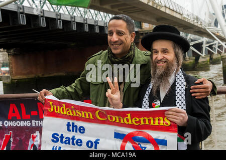 April 13, 2018 - London, UK. 13th September 2018. A vigil on the South Bank of the River Thames on Palestinian Prisoners Day highlights the plight of the roughly 6,500 Palestinians currently in Israeli jails, around 350 of them children. The protesters included several Palestinians and were joined by an anti-zionist ultra-orthodox Jew. Their display included an actual size drawing of an Israeli underground prison cell in which children are held in isolation. The protesters handed out leaflets and talked with those walking by, and speeches gave facts about the prisoners. In two months this yea Stock Photo