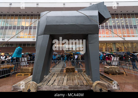 13 April 2018, Germany, Dresden: The artwork 'Trojanisches Pferd' (lit. Trojan horse) is in front of the Kulturpalast (lit. culture palace). It is from the association 'ProMitsprache' (lit. ForCodetermination), a citizens' group, which critisizes the immigration of refugees. The controversial installation is meant to be presented in the city until 16 April. Photo: dpa-Zentralbild/dpa Stock Photo