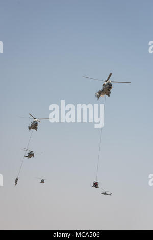 Jubail, Saudi Arabia, 14th Apr, 2018. Photo taken on April 14, 2018 shows helicopters during a ceremony show for the 'Gulf Shield Joint Exercise-1' in eastern Saudi Arabia. Troops from 25 countries performed a live-ammunition drill in eastern Saudi Arabia on Saturday, one day before the 29th Arab League Summit. Credit: Meng Tao/Xinhua/Alamy Live News Stock Photo