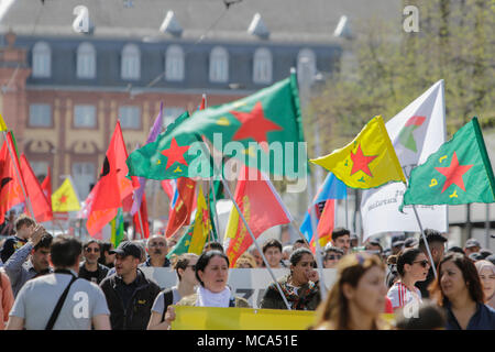 Mannheim, Germany. 14th April 2018. Protesters march with banners and flags through Mannheim. Kurdish people and German supporters marched through Mannheim to protest against the continued occupation of the Syrian city of Afrin, which was controlled by the Kurdish Popular Protection Units (YPG) before it got conquered by the Turkish army. They also protested against the German involvement via weapons exports to Turkey. Credit: Michael Debets/Alamy Live News Stock Photo