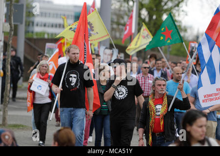 Mannheim, Germany. 14th April 2018. Protesters march with banners and flags through Mannheim. Kurdish people and German supporters marched through Mannheim to protest against the continued occupation of the Syrian city of Afrin, which was controlled by the Kurdish Popular Protection Units (YPG) before it got conquered by the Turkish army. They also protested against the German involvement via weapons exports to Turkey. Credit: Michael Debets/Alamy Live News Stock Photo