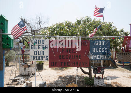 A modest house in the Texas border village of LaGrulla shows a patriotic theme. The area would be isolated by a proposed border wall on the Texas side between Mexico and the United States. Stock Photo