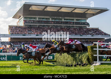 Randox Health Grand National, Aintree, Liverpool, Merseyside. 14th April 2018. Grand National horses & riders race over the Princess Royal grandstand water jump.  Credit: Mediaworld Images/Alamy Live News Stock Photo