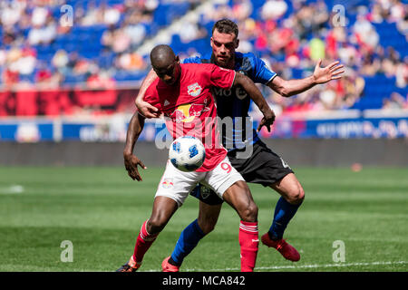 New Jersey, USA. 14th Apr, 2018. Bradley Wright-Phillips holds off a defender in the second half of the match against the Montreal Impact. Stock Photo