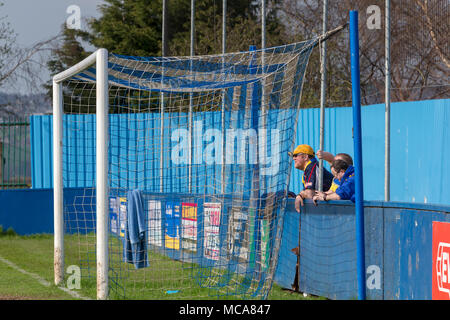 Three Warrington Town supporters stand behind the goal at Throstle Nest, Farsley during the match between Warrington Town FC and Farsley Celtic on 14 April 2018 where Warrington won 2 - 0 Credit: John Hopkins/Alamy Live News Stock Photo