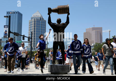 https://l450v.alamy.com/450v/mca9c4/tampa-florida-usa-14th-apr-2018-douglas-r-clifford-times-lightning-fan-jaren-mantell-of-clearwater-leaps-to-make-contact-with-a-statue-of-dave-andreychuk-while-walking-to-thunder-alley-before-the-start-of-saturdays-41418-game-between-the-tampa-bay-lightning-and-the-new-jersey-devils-in-game-2-of-the-eastern-conference-first-round-at-amalie-arena-in-tampa-credit-douglas-r-cliffordtampa-bay-timeszuma-wirealamy-live-news-mca9c4.jpg