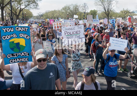 Washington, DC, USA. 14th April, 2018.  Participants in 2018 March for Science after listening to speakers at rally march to the U.S. Capitol.   Among demands, a call “for public officials to enact evidence-based policy that serves all communities.”  Bob Korn/Alamy Live News Stock Photo