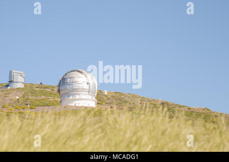Grantecan (Gran telescopio de Canarias) in Roque de los Muchachos Observatory in La Palma, Canary Islands, in spring with blue sky. Stock Photo
